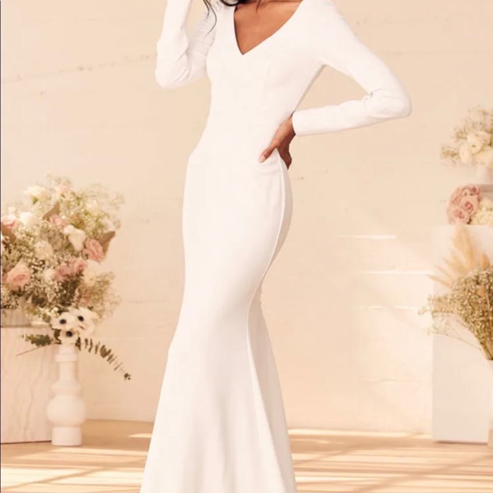 White long sleeve, classy gown with buttons down the back. Stretch material.